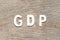 Alphabet in word GDP Abbreviation of good distribution practice or gross domestic product on wood background