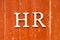 Alphabet in word HR Abbreviation of human resource on old red color wood plate background