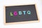 Alphabetic of colorful wooden with LGBTQ word on black background. Concept of LGBT activism