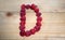 Alphabetical letter made of raspberries