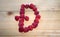 Alphabetical letter made of raspberries