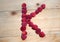 Alphabetical letter made of raspberries