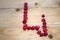 Alphabetical letter made of raspberries