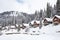 alpine cabins dusted with fresh snow