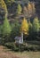 Alpine Chapel against Fall trees