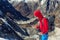 Alpine Climber using smart Phone in high Mountains