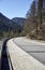 Alpine country road in the Austrian Alps - Stock Photo