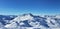 Alpine french snowy peak mountain under blue sky