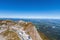 Alpine hotel and tourists at lookout at Mt Pilatus top