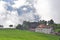 Alpine houses in clouds