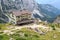 Alpine hut Rifugio Brentei and mountain alps panorama in Brenta Dolomites, Italy