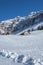 Alpine huts and Alpstein massif with Saentis in winter, Switzerland