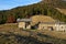 Alpine huts in autumn landscape