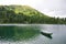 Alpine lake with boat in Hohentauern