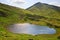 Alpine lake Nesamovyte on summer mountains