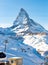 Alpine landscape with chairlift station of ski resort at foot of Matterhorn peak