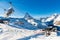 Alpine landscape with chairlift station of ski resort at foot of Matterhorn peak