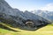 Alpine landscape with hovering paraglider