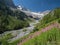 Alpine landscape with valley and snowy peaks