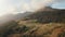 Alpine mountain countryside landscape. Aerial highlands rural road, pine tree forest, meadows