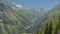 Alpine mountain landscape  with forest and granite tops with snow, France