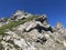 Alpine mountain peak Rossalpelispitz or Rossaelplispitz above the alpine Lake Wagitalersee Waegitalersee, Innerthal