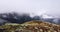 Alpine Mountain steppe. Foggy landscape. Snowy peaks in Chamonix. Northern French and Swiss scene. Panoramic aerial view