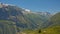 Alpine mountains and valley with forest and granite tops with snow, France