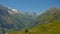 Alpine mountains and valley with forest and granite tops with snow, France