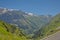 Alpine mountains and valley with forest and granite tops with snow, France