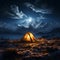 Alpine night camping Tent beneath stars, surrounded by towering peaks and tranquility