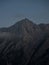 Alpine panorama view of Hoher Goell Goll mountain peak summit steep rocky stone cliff at Rossfeld Germany Austria alps