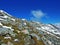 Alpine peak Falknis in the Ratikon border mountain massif or Raetikon Grenzmassiv and over the river Rhine valley Rheintal