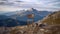 Alpine Reflections: A Serene Wooden Chair on a Mountain Peak