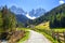 Alpine road with a beautiful view in Santa Maddalena village, Dolomites, Italy