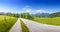 Alpine road in front of snowy Watzmann