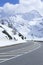 Alpine road on a snowy mountian journey thru the Alps