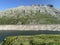 Alpine rocky peak Pizzo della Valletta 2726 m above the reservoir lake Lago di Lucendro in the Swiss mountain area