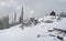 Alpine Shelter in Snow Field on Cloudy Day