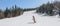 Alpine ski. Skiing woman skier going dowhill against snow covered trees background in winter Woman in red ski jacket