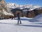 Alpine Skiers Descending a Beautiful Snowy Slope and a view of the Beautiful Surrounding Landscape of the Snow-covered of the