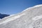 Alpine skiers on the slope of Cheget Mountain