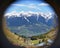 alpine snowy peak mountains  view from binoculars