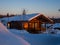 Alpine-style chalet in the Gornaya Salanga ski resort. The sun rises