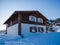 Alpine-style hotel in the ski resort Gornaya Salanga. Chalet in the snow