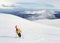 Alpine touring skier hiking in winter mountains.