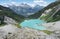 Alpine turquoise glacial Upper Joffre Lake in a valley between the mountains on a sunny summer day. View from above. Amazing color