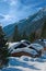 Alpine wooden houses covered with snow.