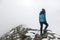 An alpinist girl on the high mountain ridge in the French Alps, Chamonix Mont-Blanc, France. Scenic image of hiking concept