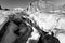 Alpinists crossing glacier crevasse, Aiguilles du Diable peak, Mont Blanc